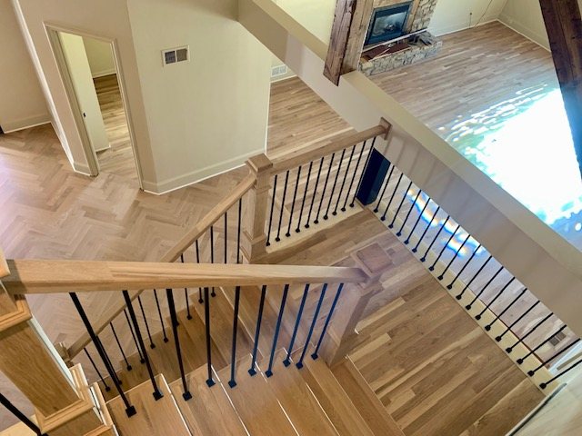 Staircase overlook with oak handrail